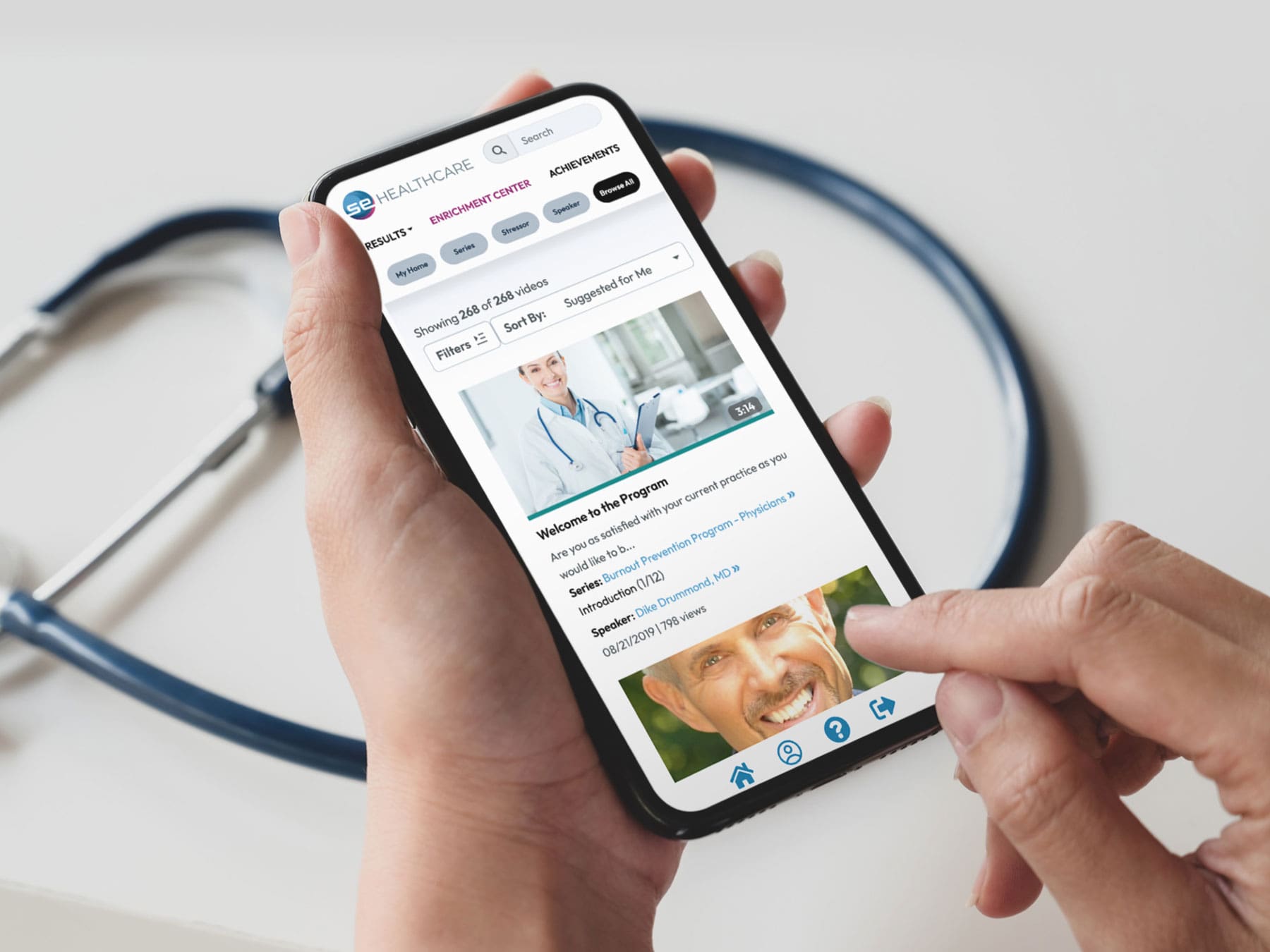 SEHQC-App-Enrichment-Phone-Hand-4-3-min