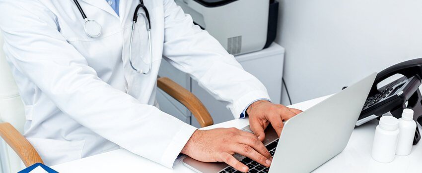 doctor-typing-on-laptop