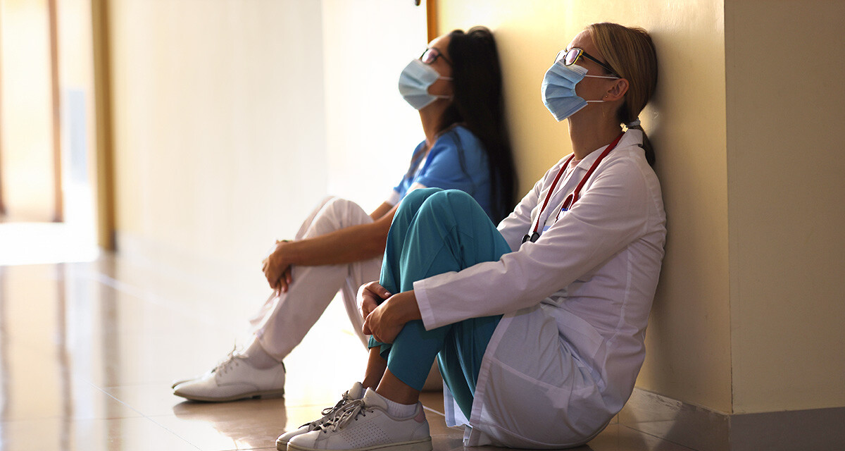 blog-nurses-seated-hallway-exhausted
